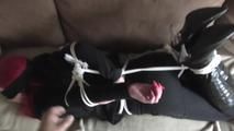 Angi hogtied on couch 2/2