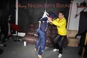 Sandra beeing tied and gagged by Stella in Shiny Nylon Rainwear crotchrope-suspended 