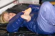 Pia lying on the bed wearing a sexy rainpants anda bra and putting on a pamy down jacket (Pics)