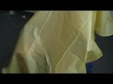 Jill tied and gagged on a chair wearing a yellow rainsuit and coveres with an yellow raincoat with two hoods (Video)