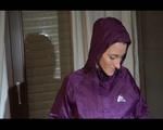 Sonja wearing a sexy purple shiny nylon rainwear combination during reordering the cupboard (Video)
