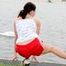 Enni having a good time outdoor wearing sexy shiny nylon shorts and a top posing for the camera (Pics)