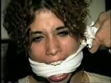 SWEET LATINA MARIE IS BALL-GAGGED, OTM-GAGGED, WRISTS-GAGGED, CLEAVE-GAGGED, MOUTH STUFFED & HANDGAGGED (D48-4)