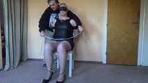 Cuffed and gagged on a chair 2