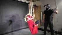 Marie bound, gagged and suspended in a shiny nylon Jumpsuit