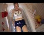 Watching Sandra wearing a sexy blue shiny nylon shorts and a top while playing with water in her bath tub (Video)