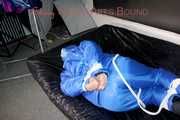 Lucy wearing sexy lightblue downwear tied and gagged with ropes and cloth gag on a bed (Pics)