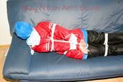 Jill tied, gagged and hooded on the sofa wearing a sexy black shiny nylon pants and two rain jackets (Pics)