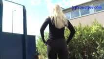 069017 Tiffany Pees Behind A Parked Trailer
