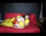 Sexy Mara wearing only a red shiny nylon shorts lolling and posing on the sofa (Video)