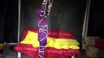 Watching sexy Sonja wearing a supersexy purple shiny nylon rainwear combination being tied and gagged overhead with ropes and a clothgag (Video)