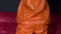 Watching sexy Pia putting on an orange AGUlike rainwear combination feeling comfortable in it and posing for you (Video)