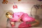 Sonja ties and gagges herself in the bath tub with cuffs wearing sexy shiny nylon downwear (Pics)