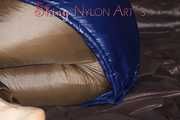 Sexy Sonja changing clothes to a brown down pants and a blue down jacket and lolling on the sofa (Pics)