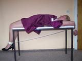 Hogtied on a table