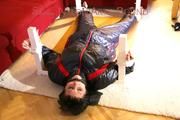 Mara tied and gagged on a bottom-up table wearing a supersexy black/red downwear combination (Pics)