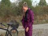 Get a Video with Sandra riding her bike enjoying her shiny nylon Rainwear