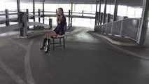 Stella on chair at car park 1/2