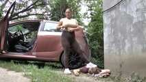 Mistress Jenna stands on the slave with a car while smoking in the slave's mouth B