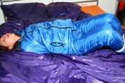 Alina tied and gagged in a shiny skisuit