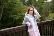 Miss Petra in hot vinyl skirt, overknee boots and raincoat at the photo shoot