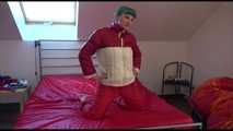 Watching sexy Mara during a photo shooting wearing a sexy red shiny nylon rainpant and an oldschool red/white shiny nylon down jacket posing infront of the camera (Video)