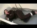 Watch Maggy beeing bound and gagged in a bathtube wearing a shiny nylon Skisuit from our Archives 2012