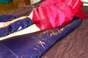 Lucy tidiing up her cupboard and lolling in bed wearing a red/white shiny nylon shorts and a red rain jacket (Pics)