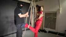 Marie bound, gagged and suspended in a shiny nylon Jumpsuit