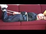 03:06 Min. video with Nina tied in a blue nylon rainsuit
