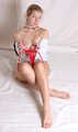 Cleavegagged barefoot topless Albina Rose in unbuttoned white shirt and red panties, bound with hemp rope, poses for the camera