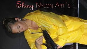 Watching sexy Sandra wearing a hot yellow shiny nylon rainwear combination during her housework (Pics)