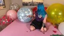 nail2pop big balloons on bed