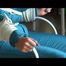 Pia tied and gagged on a chair wearing a shiny green downsuit (Video)