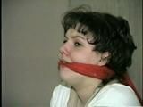 19 Yr OLD JENNIFER IS MOUTH STUFFED, TAPE GAGGED, TIED WITH ARMS OUT AND TO 2 PILLARS & CLEAVE GAGGED (D48-10)d, bondage