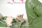 MARA ties and gagges herself in a bath tub cuffs and a cloth gag wearing a super sexy super shiny green rubber rainsuit (Pics)