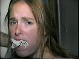 24 Yr OLD CRAFTER IS WRAP TAPE GAGGED, BAREFOOT TICKLED, TOE-TIED, BALL-TIED, HANDGAGGED & MOUTH STUFFED (D61-1)