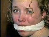 19 YEAR OLD COLLEGE STUDENT SHANA IS TIGHTLY BOUND TO A CHAIR AND HAS HER MOUTH STUFFED & CLEAVE GAGGED ON SCREEN 2 TIMES (D53-10)