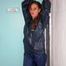 Stella tied and gagged in a shiny blue rainsuit