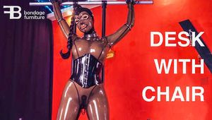 All in latex - Sophie standing fixed to the bondage couch