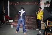 Sandra beeing tied and gagged by Stella in Shiny Nylon Rainwear crotchrope-suspended 