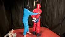 Sebastien breathplay in a red PVC jumpsuit.