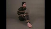 4 short videos in one of an beautiful black haired archive girl tied and gagged on the floor wearing sexy shiny nylon rainwear (Video)