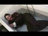 Watch Maggy beeing bound and gagged in a bathtube wearing a shiny nylon Skisuit from our Archives 2012