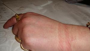 Hands behind her back