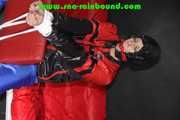 Sexy PIA wearing a sexy blue rainbib and a black/red shiny nylon rainjacket being tied, gagged and hooded on a chair with ropes and a ballgag (Pics)