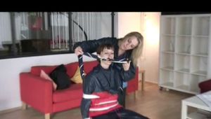 03:40 Min. video with Nicole tied and gagged in shiny nylon rainwear
