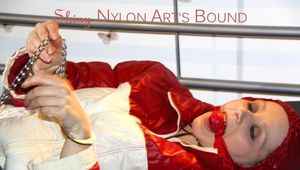 Lucy ties, gagges and hoodes herself on a bed wearing a sexy oldschool downwear combination (Pics)