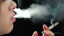 A young lady showing her smoking skills in a closeup video 