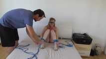 Maria roped on her bed 1/2